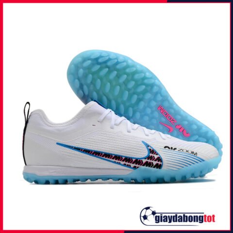 Giày đá bóng Nike Mercurial Vapor 15 Pro TF màu trắng với logo đen và đế xanh nổi bật
