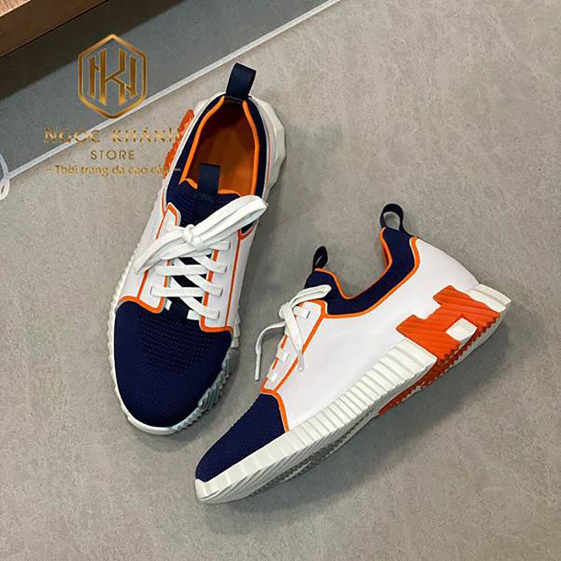 Giày sneaker Hermes nam trắng phối xanh viền cam với chi tiết chữ H độc đáo