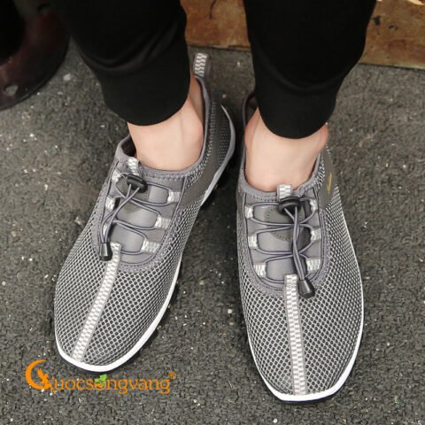 Giày thể thao lưới thoáng khí màu xám với thiết kế buộc dây năng động, phù hợp mọi hoạt động.