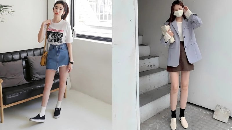 Một cô gái với chân váy chữ A màu xanh, áo len trắng và giày lười (loafers) màu đen bóng, toát lên vẻ trẻ trung và sành điệu.