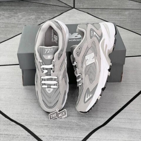 Một đôi giày New Balance 725 màu xám tinh tế, thể hiện phong cách retro hiện đại.