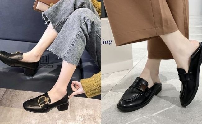 Người mẫu mặc quần jean ống rộng tối màu và giày loafer đen bóng, áo sơ mi kẻ sọc