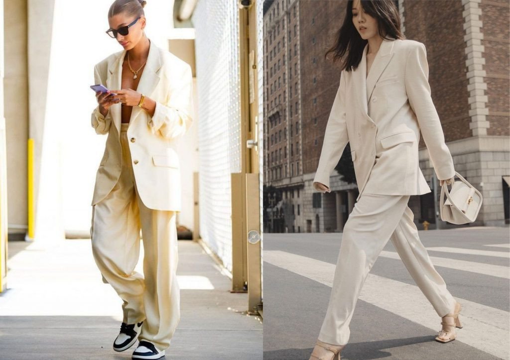 Phụ nữ mặc vest be và quần âu, phối với giày cao gót trắng