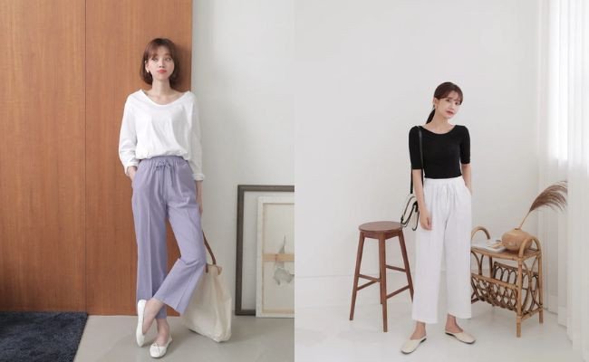Set đồ nữ tính: quần jean ống rộng và giày búp bê đen cùng áo sơ mi trắng.